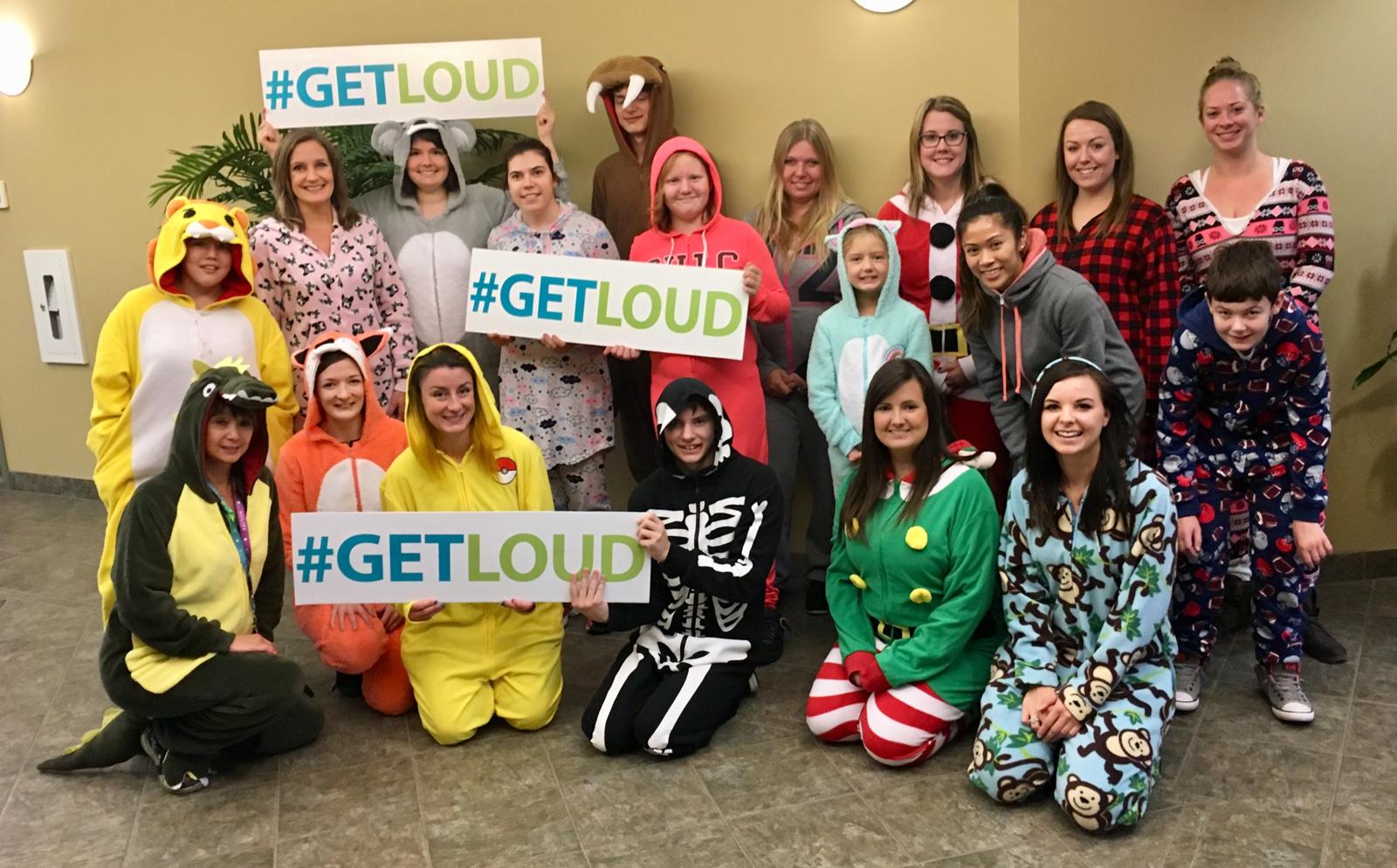 Teresa May and fellow volunteers in onesies for the Get Loud mental health campaign in 2017, a fundraiser she founded for CMHA Kelowna.