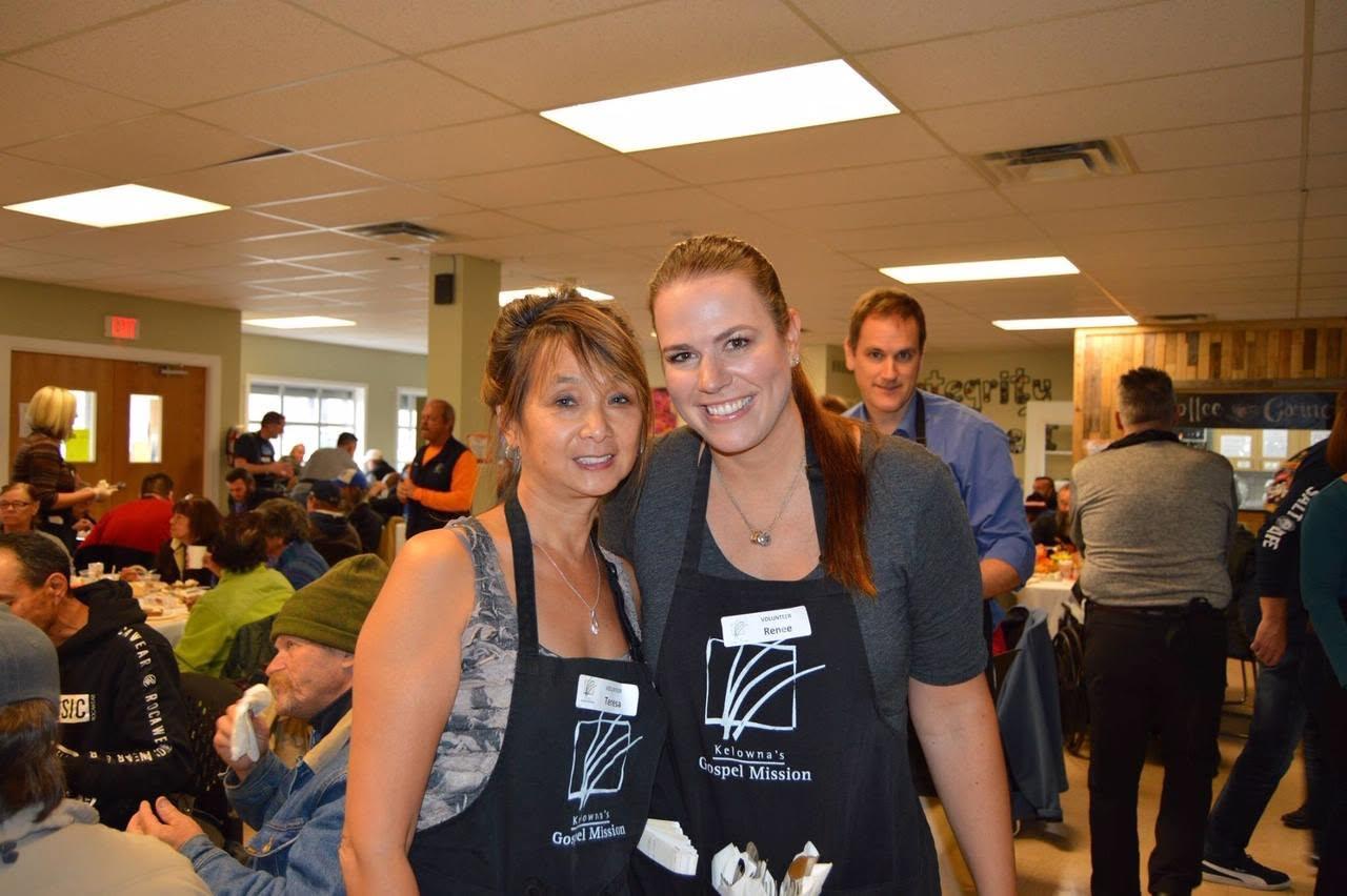 Teresa May in a volunteer apron serving the Thanksgiving meal at Kelowna's Gospel Mission in 2018.