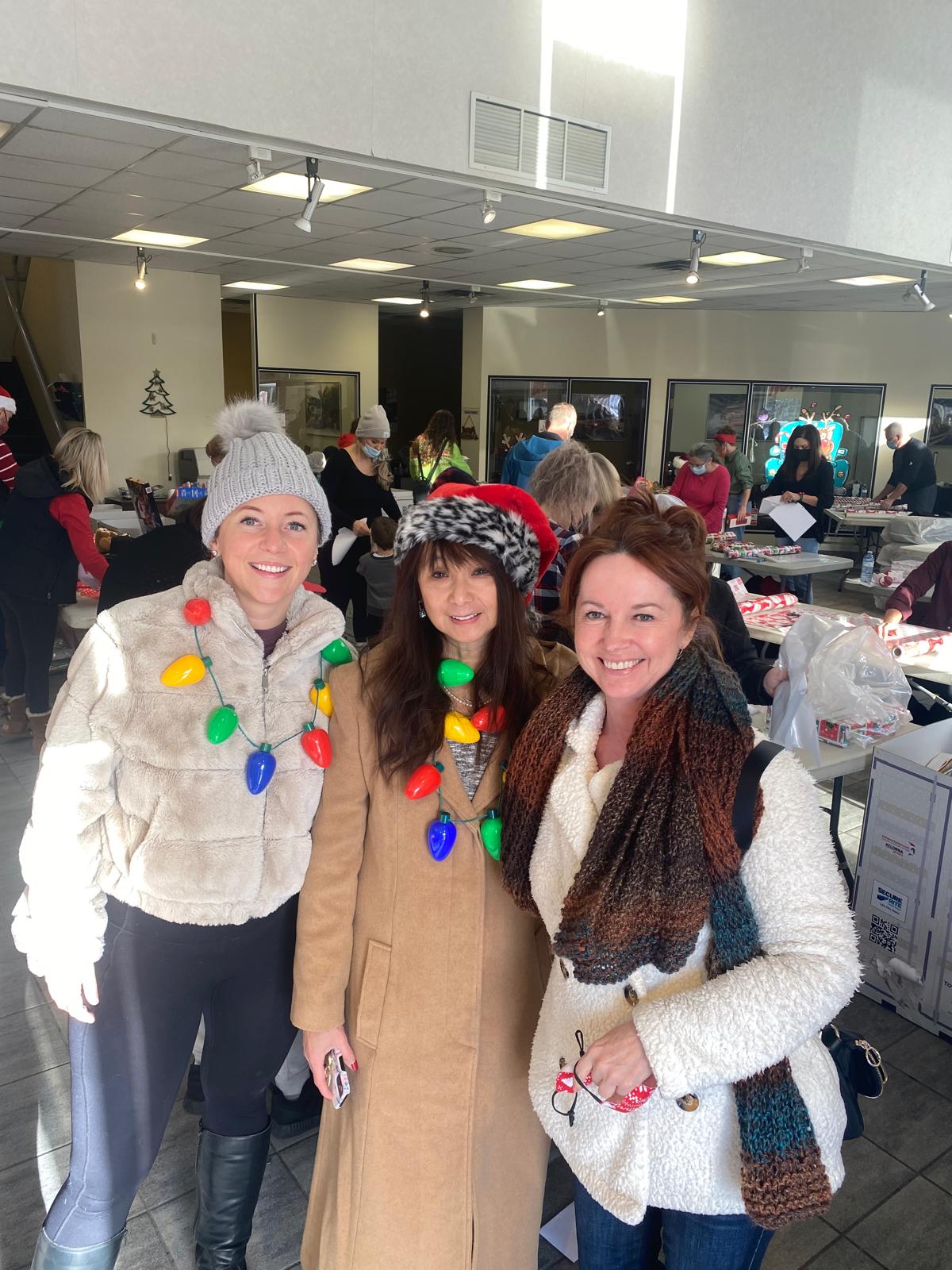 Teresa May with fellow Kelowna Santas volunteers at a Christmas gift-wrapping event in 2021.